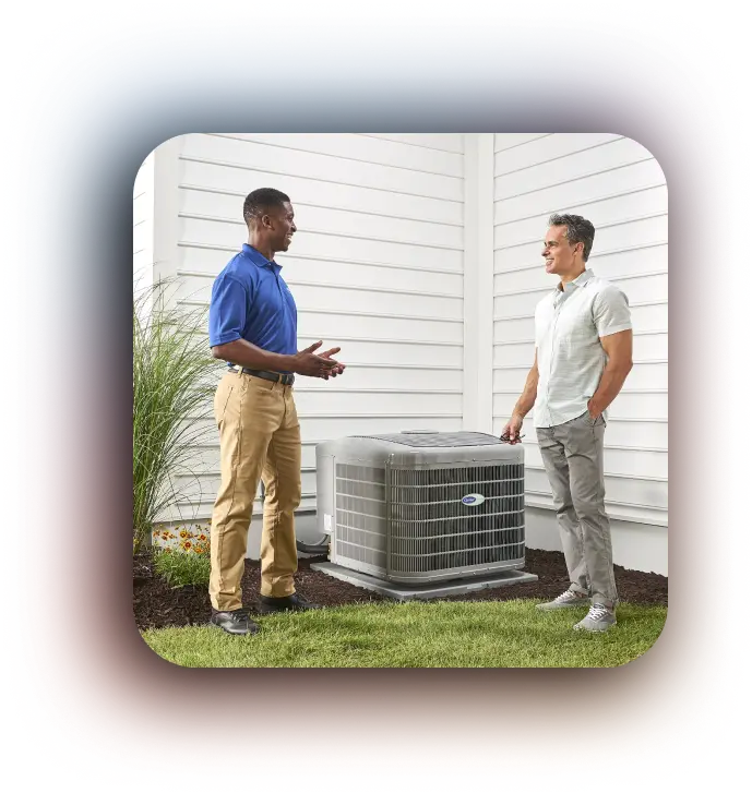 two men talking by a new carrier ac unit