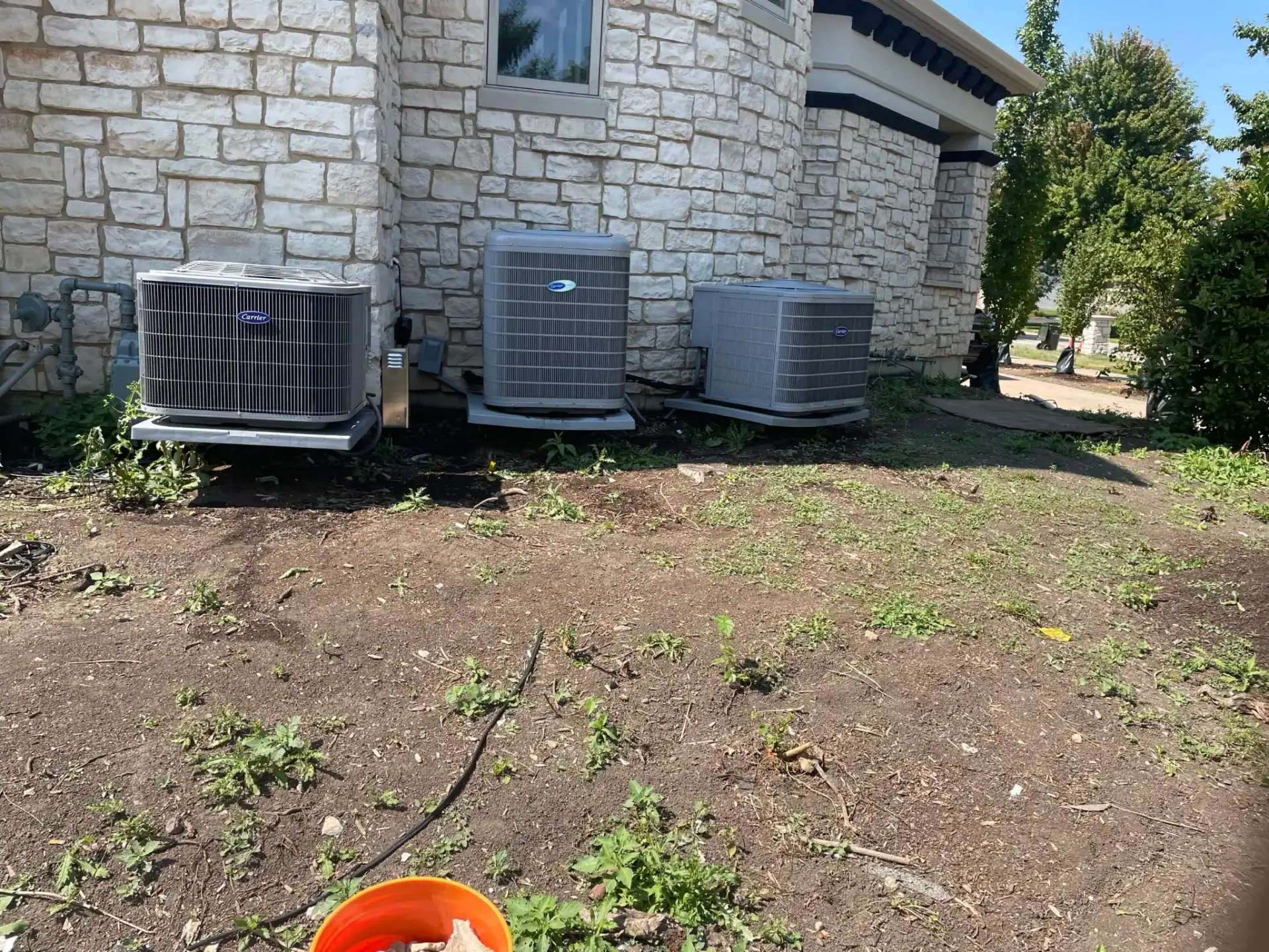 Maintenance on three air conditioners at a Naperville, IL home by Fire 'n' Ice